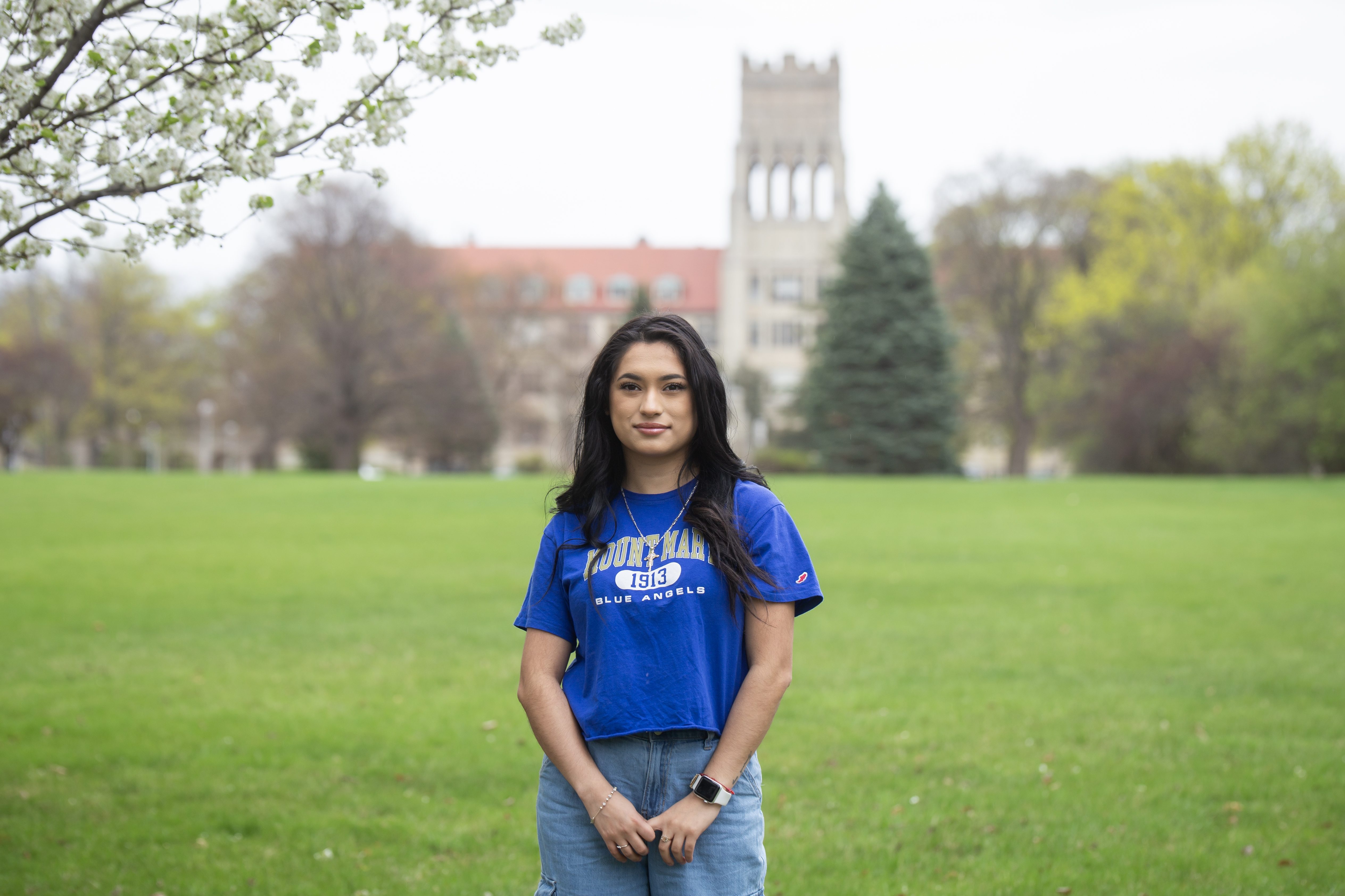 student in front of campus